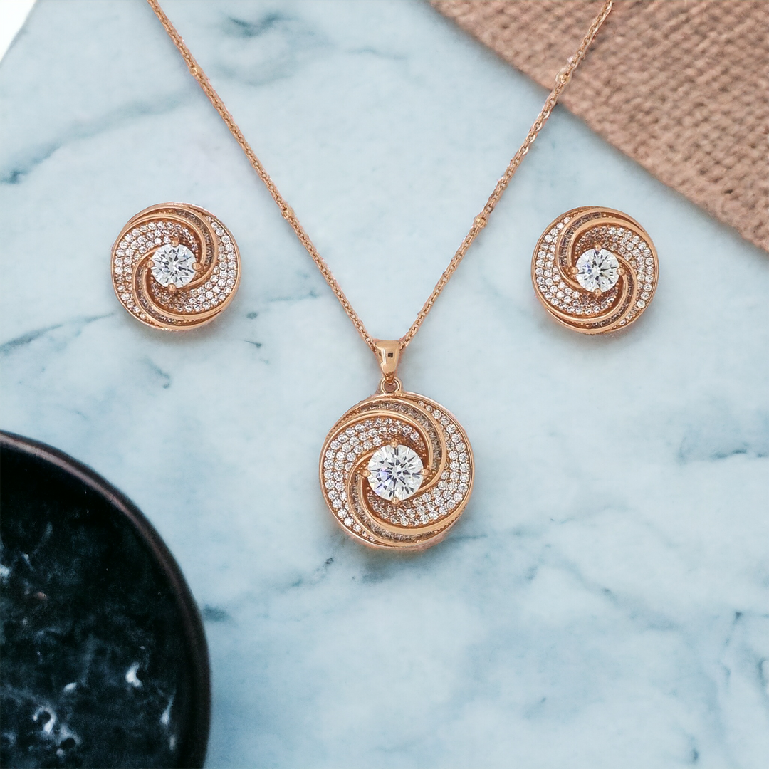 Designer Silver Pendant and matching earring set with Rose Gold plated.