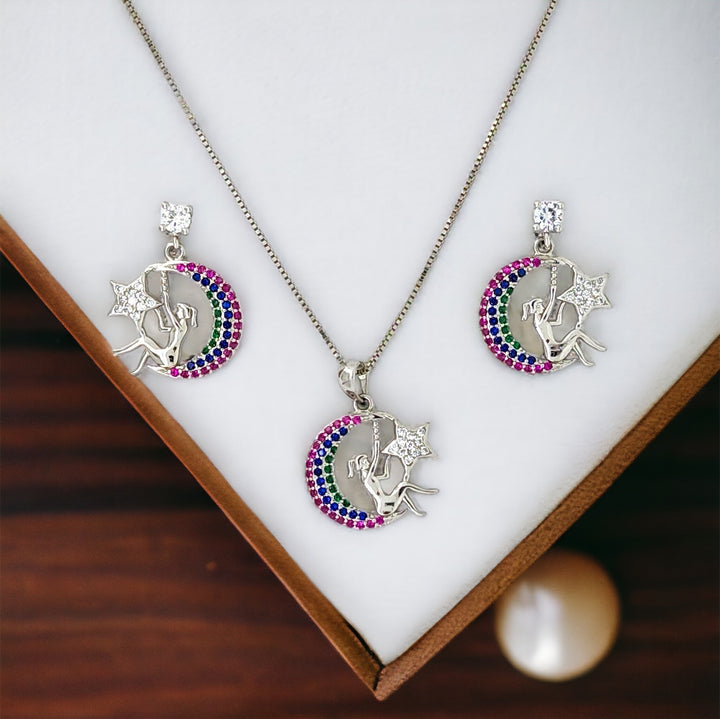 lady sitting with moon and star designer silver pendant with matching earring set